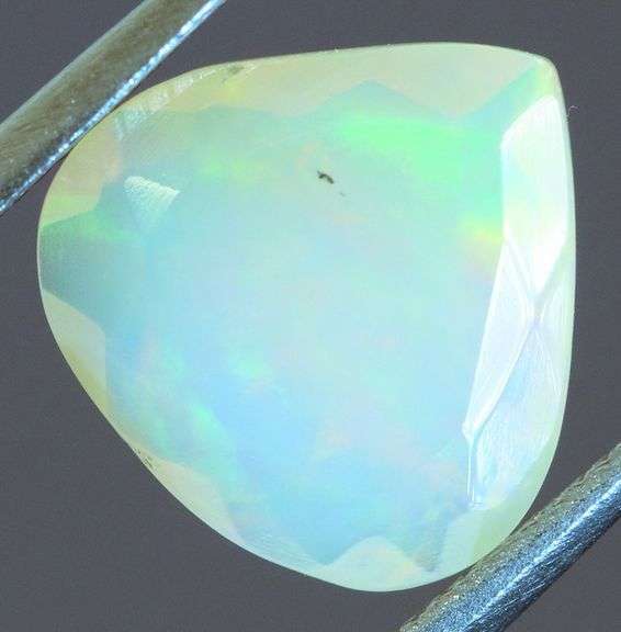 Tremendous glittering 1.23ct faceted Jelly Opal