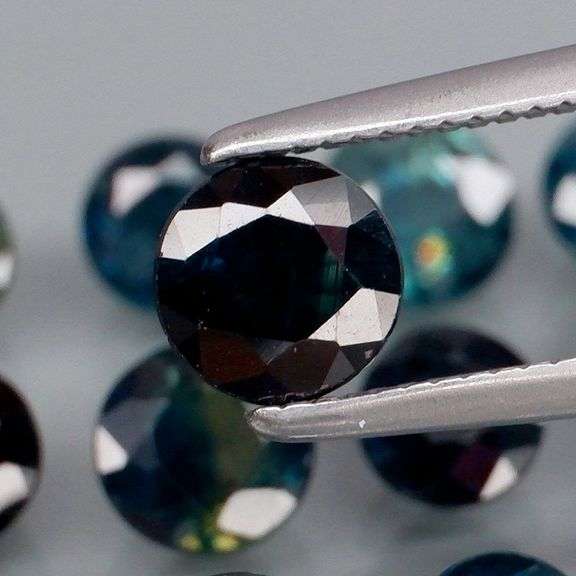 Heated only! 7.63ct deep blue sapphire set