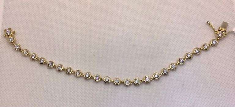 STUNNING 18K YELLOW GOLD BEZEL SET DIAMOND BRACELET