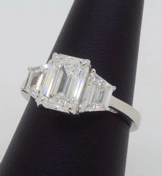 Incredible 3.05CTW Emerald & Trapezoid Three Stone Diamond Ring