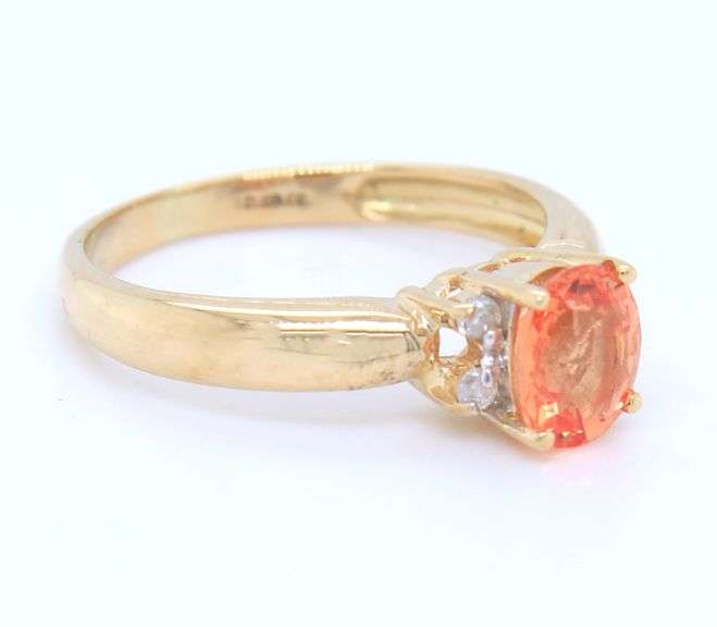 18kt Yellow gold 0.56ct Padaradscha sapphire and diamond accent ring