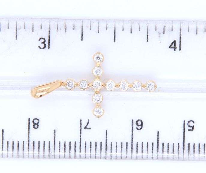 14kt Yellow gold approximate 0.25ctw diamond cross pendant