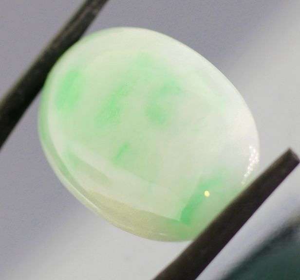 Uncommon 26.45ct light green Jadeite Jade cabochon