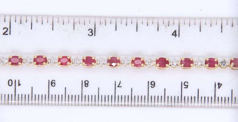 14kt Yellow gold oval Ruby and diamond tennis bracelet