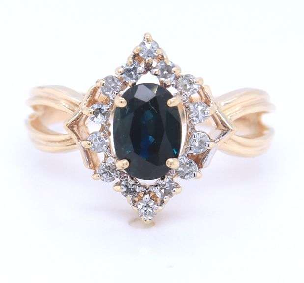 14kt Yellow gold oval blue sapphire and diamond halo marquise shaped ring
