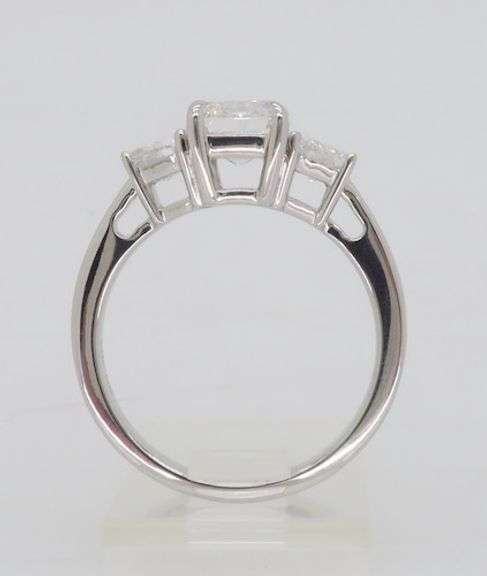 Incredible 3.05CTW Emerald & Trapezoid Three Stone Diamond Ring