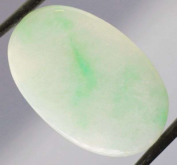 Uncommon 26.45ct light green Jadeite Jade cabochon