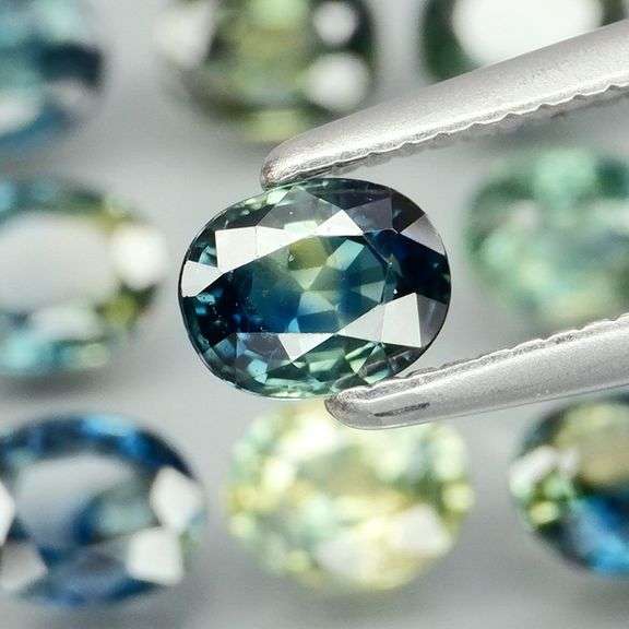 Heated only! 3.80ct blue green sapphire set