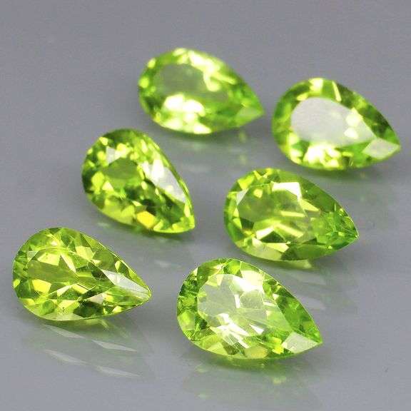 Dazzling 5.64ct untreated apple green Peridot set