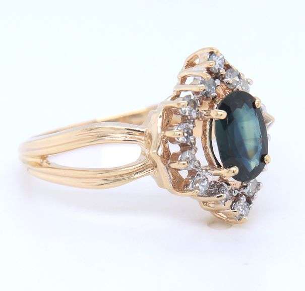 14kt Yellow gold oval blue sapphire and diamond halo marquise shaped ring