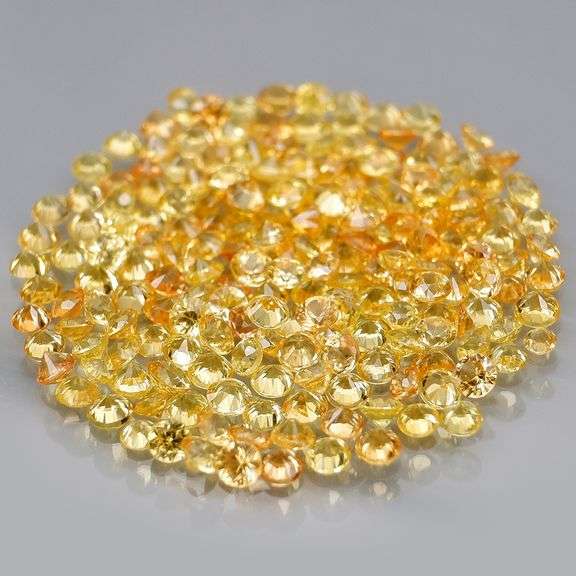 Charming 4.58ct golden yellow round cut Sapphire set