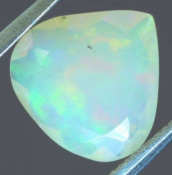 Tremendous glittering 1.23ct faceted Jelly Opal