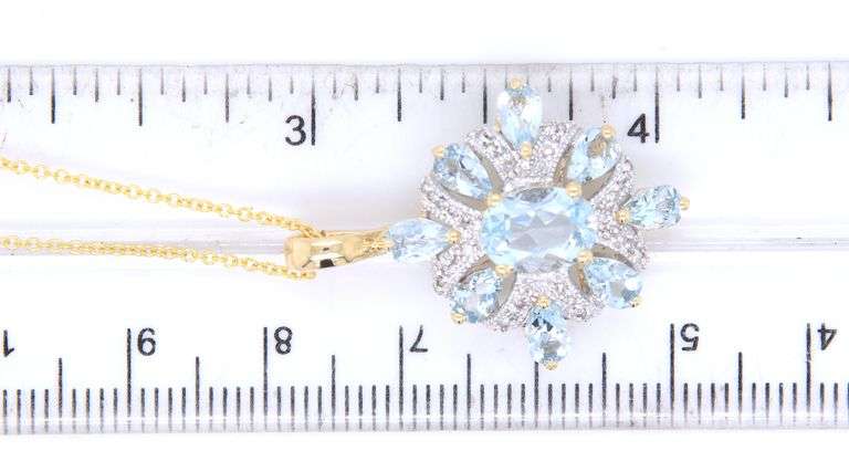 14kt Yellow gold Aquamarine and diamond accent pendant on chain necklace