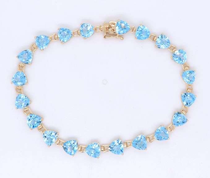 14kt Yellow gold heart shaped blue topaz tennis bracelet