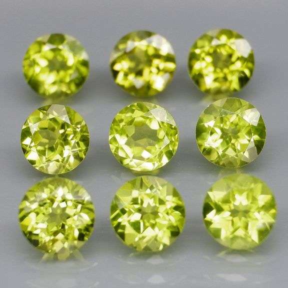 High grade 5.11ct untreated apple green Peridot set