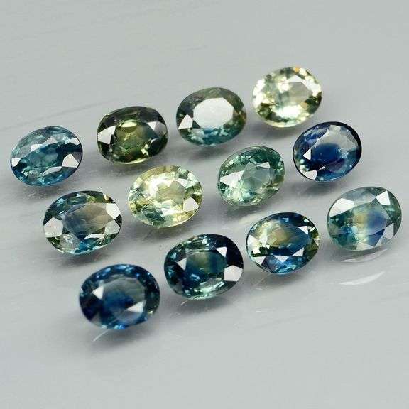 Heated only! 3.80ct blue green sapphire set
