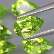 Dazzling 5.64ct untreated apple green Peridot set