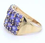 14kt Yellow gold oval and round Tanzanite cluster wide band