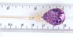14kt Yellow gold fancy pear shaped amethyst and diamond pendant on chain necklace