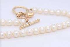 5.5mm White fresh water pearl bracelet with heart key charm
