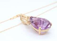 14kt Yellow gold fancy pear shaped amethyst and diamond pendant on chain necklace