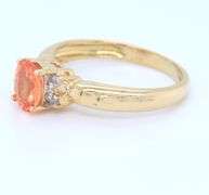 18kt Yellow gold 0.56ct Padaradscha sapphire and diamond accent ring
