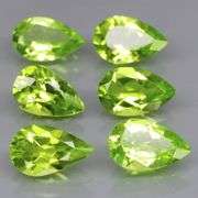 Dazzling 5.64ct untreated apple green Peridot set