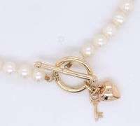 5.5mm White fresh water pearl bracelet with heart key charm