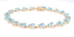 14kt Yellow gold heart shaped blue topaz tennis bracelet