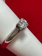 CERTIFIED PLATINUM DIAMOND SOLITAIRE RING. 0.57 CARAT