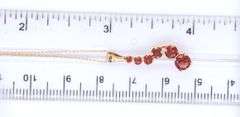 14kt Yellow gold garnet journey pendant on chain necklace