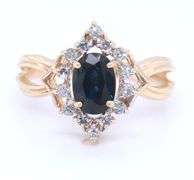 14kt Yellow gold oval blue sapphire and diamond halo marquise shaped ring