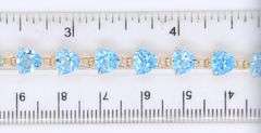 14kt Yellow gold heart shaped blue topaz tennis bracelet