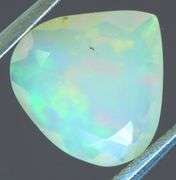 Tremendous glittering 1.23ct faceted Jelly Opal