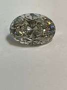 CERTIFIED 5.01 CARAT OVAL SHAPED DIAMOND.