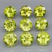 High grade 5.11ct untreated apple green Peridot set