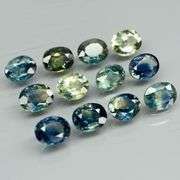 Heated only! 3.80ct blue green sapphire set