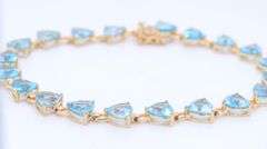 14kt Yellow gold heart shaped blue topaz tennis bracelet