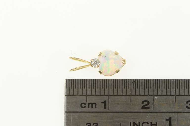10K Yellow Gold Heart Syn. Opal CZ Accent Love Symbol Pendant