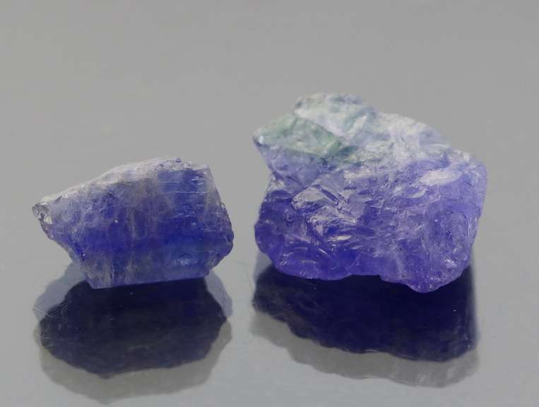 Stunning 36.43ct rich blue violet uncut Tanzanite pair