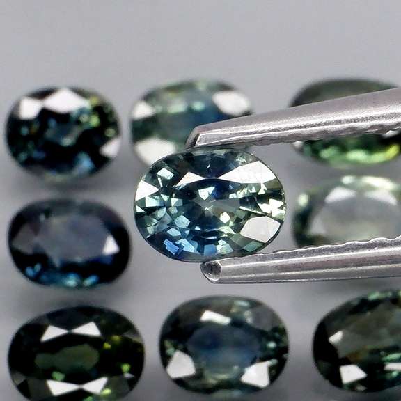 Heated only! 3.98ct blue green sapphire set