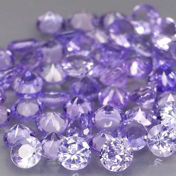 Heavy flashing 4.44ct diamond cut Tanzanite set