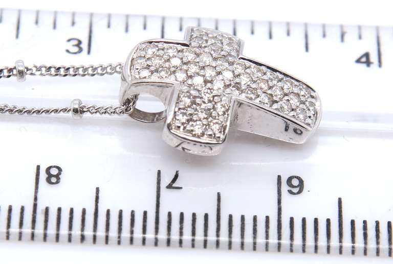 Dazzling White Gold Pave Diamond Cross on Saturn Chain