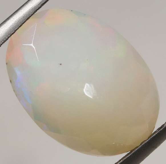 Smoldering flashing 2.97ct faceted Opal