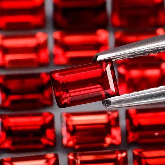 Nice 8.13ct emerald cut cherry red Garnet set
