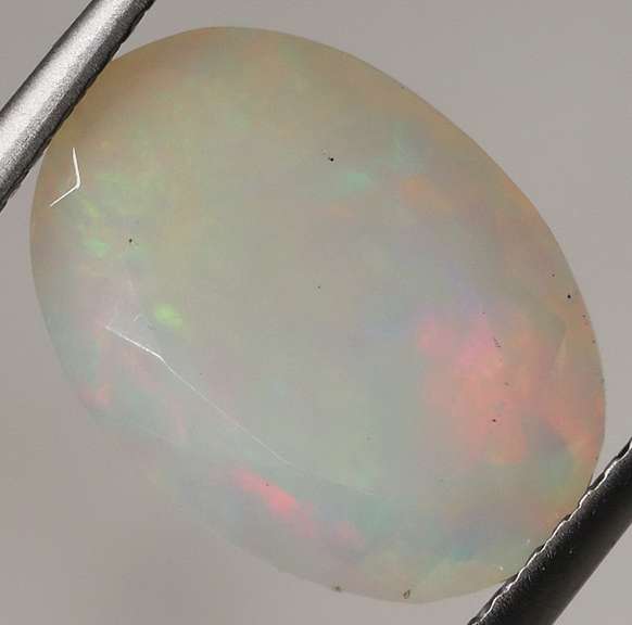 Smoldering flashing 2.97ct faceted Opal