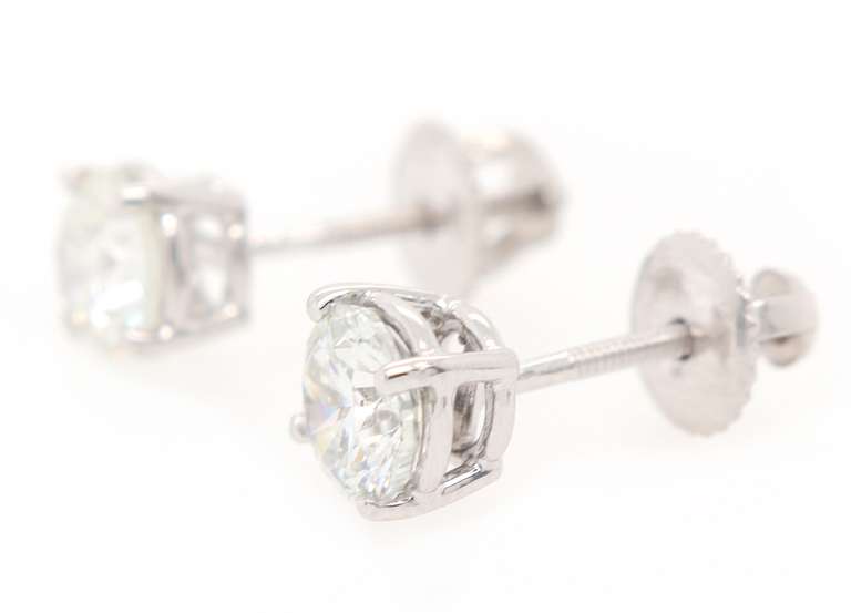 Elegant 1.44ctw Round Diamond Solitaire Stud Earrings