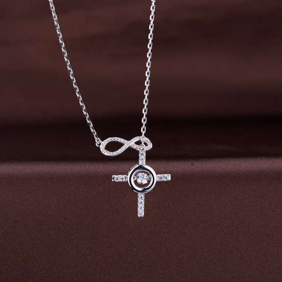 Beautiful Platinum over non tarnish Sterling silver infinity with cross pendant
