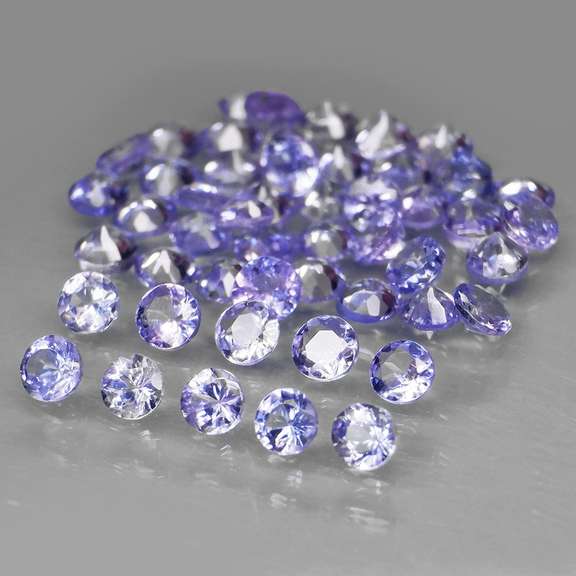 Heavy flashing 3.32ct diamond cut Tanzanite set