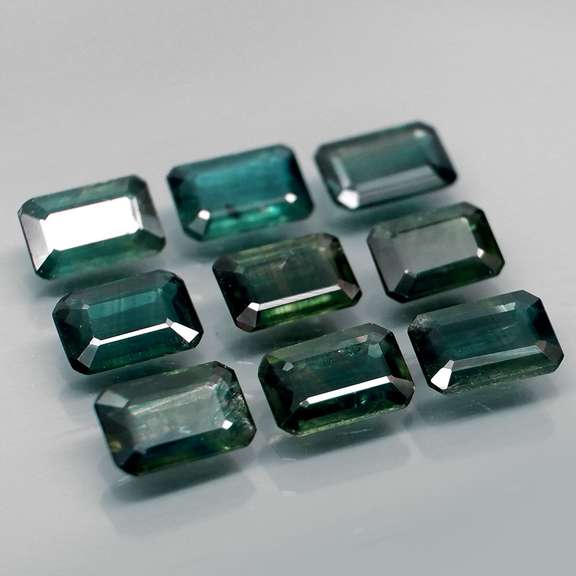 Heated only! 5.32ct blue green sapphire set